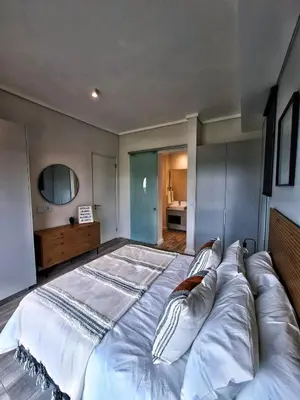 a large bed with pillows in a bedroom at Menlyn Maine Apartment - 738 at Maine in Pretoria