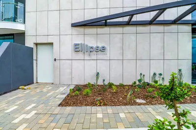 a building with a sign on the side of it at Waterfall Ellipse-4014 Patimo Opulent Apartment in Midrand