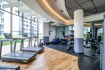 a gym with treadmills and elliptical machines at Waterfall Ellipse-4014 Patimo Opulent Apartment in Midrand