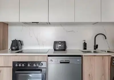 a kitchen with a stove and a sink at Morden Waterfall Escape in Midrand