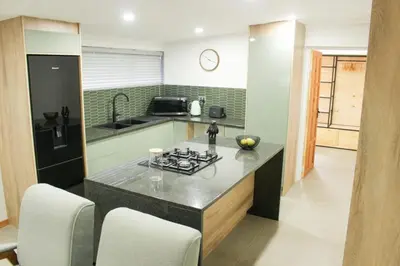 a kitchen with a counter with a stove in it at Boūs in Graskop