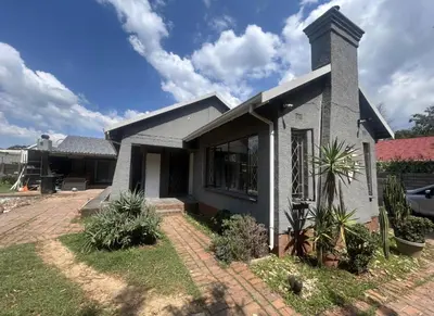 a house with a brick driveway in front of it at Madlabeezy in Kempton Park