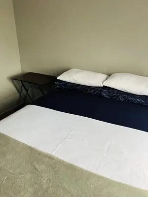 a bedroom with two beds and a night stand at Kasi Retreat in Northam