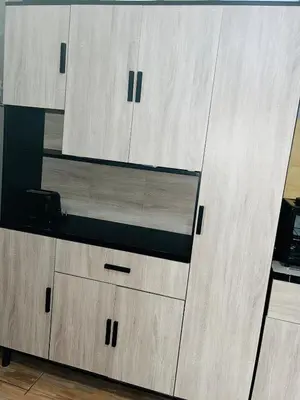 a large wooden cabinet with drawers in a room at Kasi Retreat in Northam