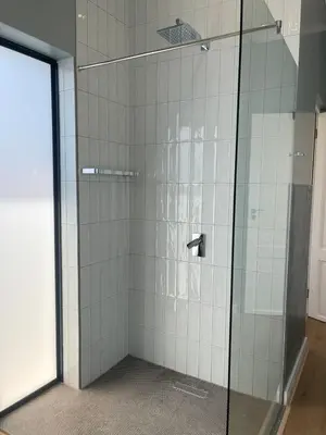 a shower with a glass door in a bathroom at Gratia et Pax in Dullstroom