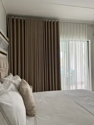 a bedroom with a bed and a large window at The Dream Escape At The Blyde - Lagoon Facing 3 Bedroom Apartment in Pretoria