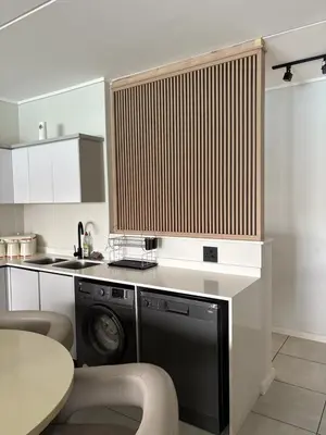 a kitchen with a washer and a dishwasher at The Dream Escape At The Blyde - Lagoon Facing 3 Bedroom Apartment in Pretoria