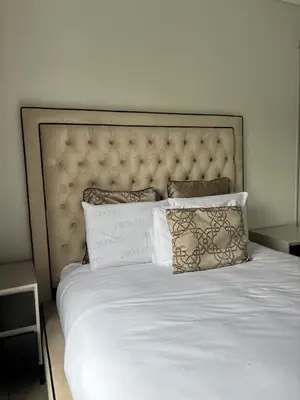 a large white bed with pillows on top of it at The Dream Escape At The Blyde - Lagoon Facing 3 Bedroom Apartment in Pretoria