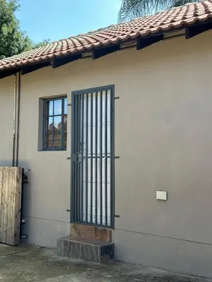 a gate on the side of a house at Sky blue in Polokwane