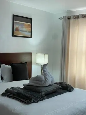 a swan made out of a blanket on a bed at Green View Guest House Middelburg in Middelburg