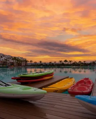 a group of boats on the water at sunset at TwoHorse Properties in Pretoria