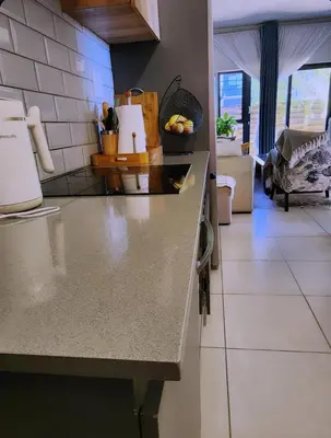 a kitchen with a counter top in a room at Ibunami in Midrand