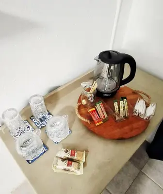 a table with a tea kettle on a table at Golden Stay Guest House in Nelspruit
