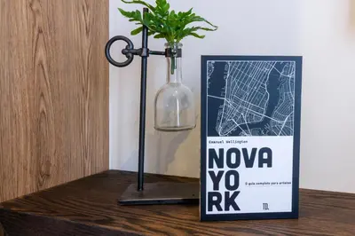 a vase with a plant in it next to a sign at #AlimamaSpaces The Nook Menlyn Maine Studio in Pretoria