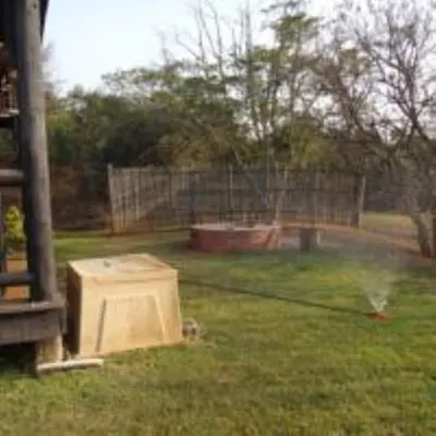 a water hose in a yard with a box at Hazyview Country Estate in Swartfontein