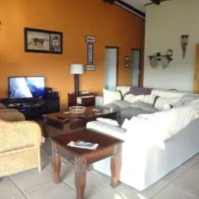 a living room with a couch and a coffee table at Hazyview Country Estate in Swartfontein
