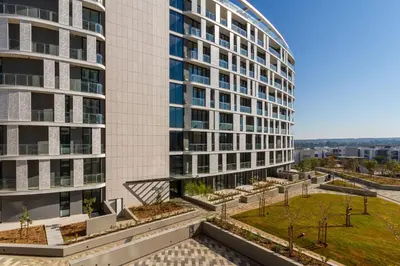 an exterior view of a tall building at #AlimamaSpaces The Ace's Ellipse in Midrand