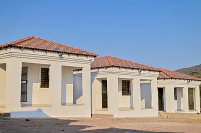 a row of houses with red roofs at Sunset Lodge - Gundani in Thengwe