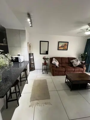 a living room with a couch and a table at 458 on Manitoba in Pretoria