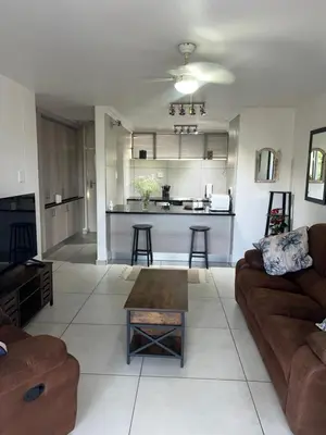 a living room with a couch and a table at 458 on Manitoba in Pretoria