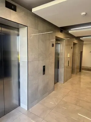 a row of elevators in a hallway in a building at Ellipse Waterfall in Midrand
