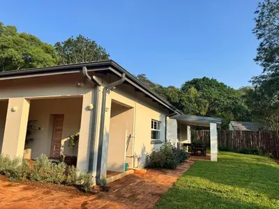 a small white house with a yard at Scandi House in Louis Trichardt