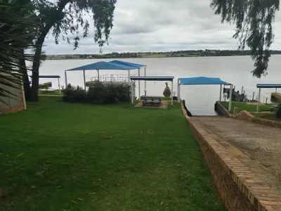 a picnic area with a view of a lake at Elephant hide away in Witbank