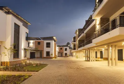 an empty courtyard of an apartment building at night at Perfect place for family in Pretoria