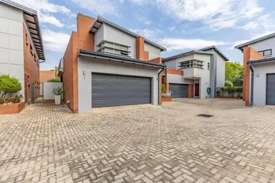 a house with a garage on a brick driveway at Perfect place for family in Pretoria