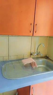 a sink with a pink towel sitting on top of it at Yolipopsta stays in Kempton Park