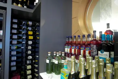 a display of bottles of alcohol in a store at Elipse Waterfall Luxe Executive Apartment in Midrand