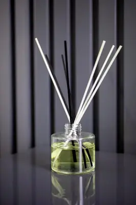 a glass vase with sticks in it on a table at Menlyn Pretoria 732 in Pretoria