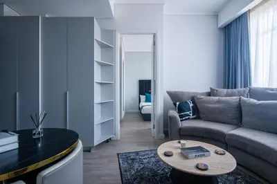 a living room with a couch and a table at Menlyn Pretoria 732 in Pretoria