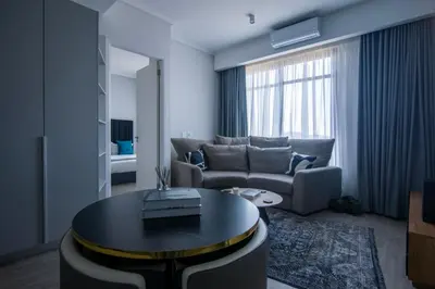 a living room with a couch and a table at Menlyn Pretoria 732 in Pretoria