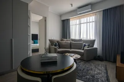 a living room with a couch and a table at Menlyn Pretoria 732 in Pretoria