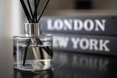 a glass vase with sticks in it on a table at Menlyn Pretoria 732 in Pretoria