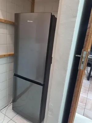 a stainless steel refrigerator in the corner of a kitchen at Sunset Retreat in Polokwane