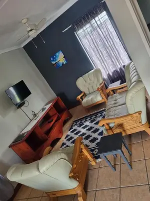 an overhead view of a living room with a couch and chairs at Menatwork contractors accommodation in Nelspruit