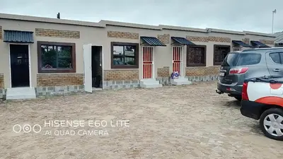 a vehicle parked in front of a building at Ermelo Executive Rooms in Ermelo