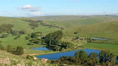 an aerial view of a valley with two lakes at Elandskloof Trout Farm in Dullstroom
