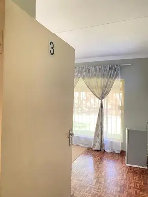 a room with a door with a window at Ranx Guest House in Pretoria