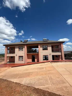 a large brick building with a large courtyard at Royal nest Sibasa in Thohoyandou