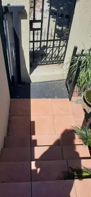 a shadow of a person walking down the stairs at Villa at Wekker Upstairs in Pretoria
