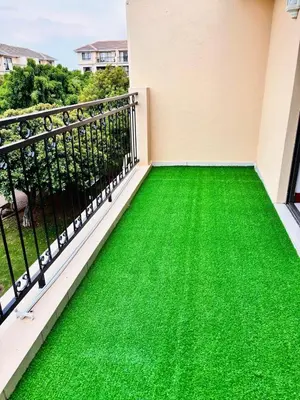 a balcony with green flooring in a house at Adilo Villa Midrand Hill of Good Hope 2 in Midrand