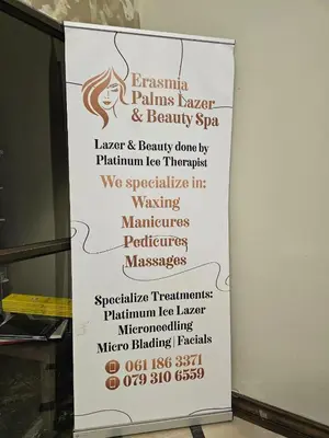a sign for a spa with a list of treatments at Palms Erasmia in Centurion