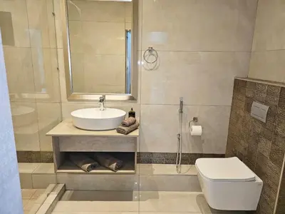 a bathroom with a sink and a toilet at Palms Erasmia in Centurion