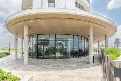 a large building with a large glass facade at Elegant AirConditioned Neria at Ellipse Waterfall in Midrand