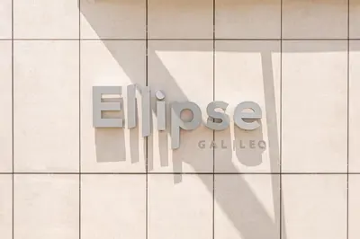 a sign on the side of a building at Elegant AirConditioned Neria at Ellipse Waterfall in Midrand