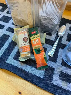 two bags of food sitting on top of a rug at the Host at Bingos House in Thohoyandou
