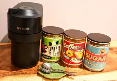 three cans of food sitting next to a food processor at The Roaming Goat Guesthouse in Toekoms